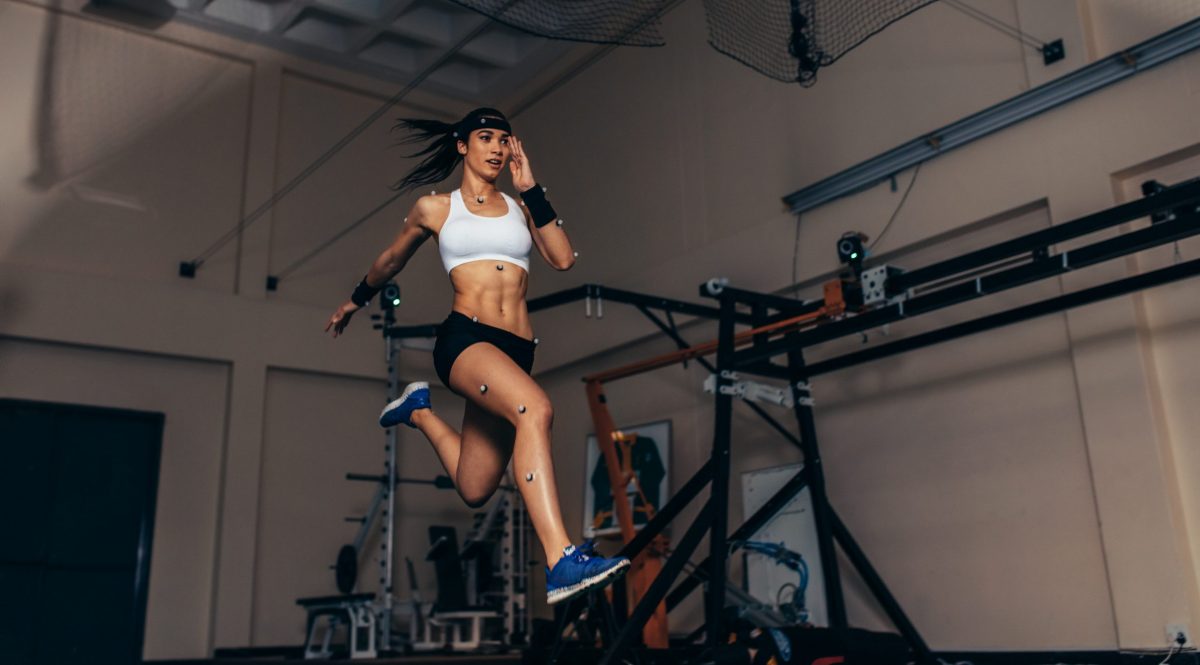 a woman running while wearing motion analysis markers