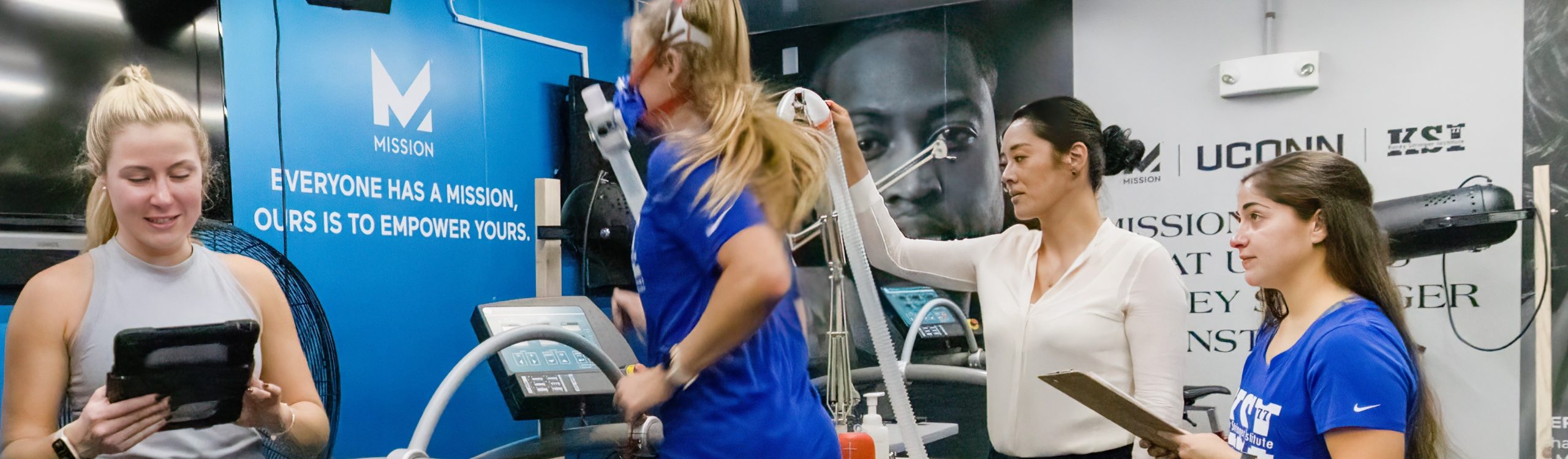 Woman on a threadmill being monitored