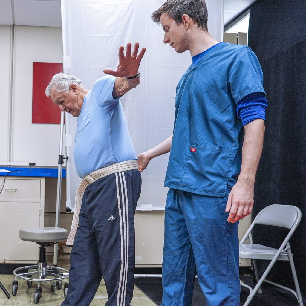 Students monitoring a patient's blood pressure