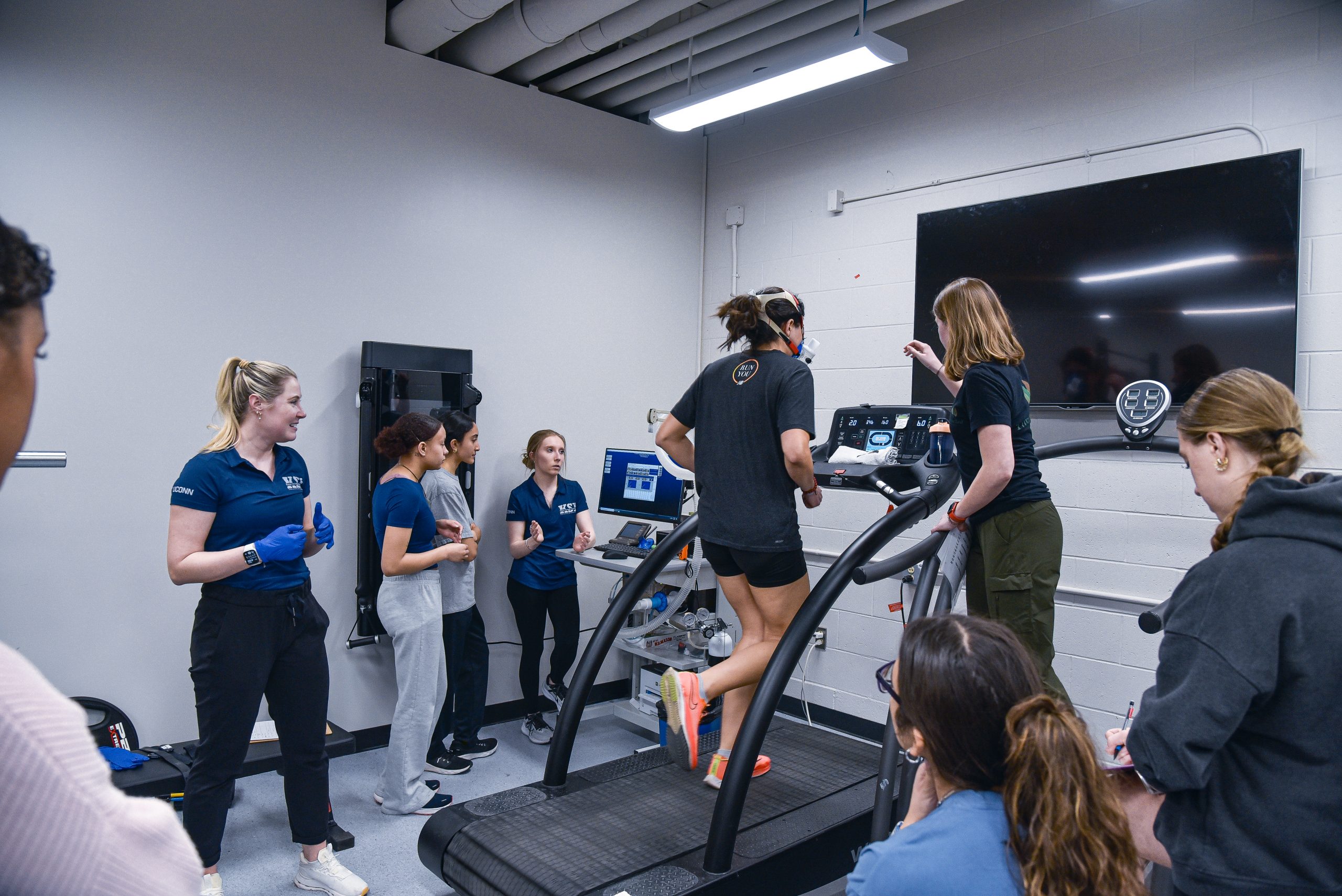 Sudents monitoring an athlete's vitals